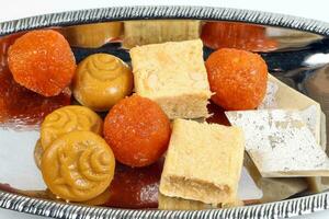 Laddu laddoo motichoor bundi  Soan papdi papri shonpapri Sandesh shondesh traditional Bengali sweets photo