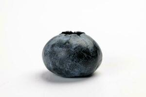 Fresh ripe deep purple Blueberry on white background macro closeup photo