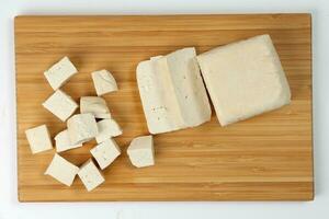 Soyabeans soya bean curd tofu wooden board block slice dice chopped photo