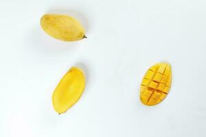 ripe yellow mango cut slice whole on white background photo