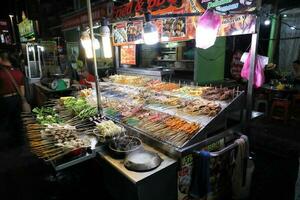 KUALA LUMPUR, MALAYSIA- MARCH 28, 2018 Hosting a lot of hawker stalls and seafood restaurants, Jalan Alor is one of the most famous roads in Kuala Lumpur for food. photo