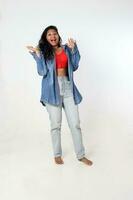 Young attractive Asian Indian woman pose face body expression mode emotion on white background shocked surprised stand hand in the air photo