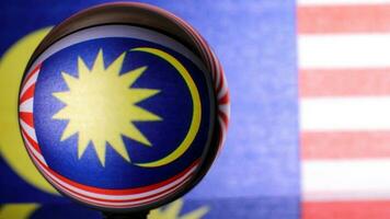 Malaysian flag refraction through glass crystal ball country independence patriot concept photo