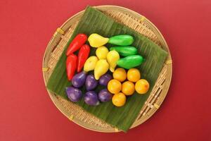 Colourful Luk chup look choop tadeonal Thai desert sweets candy creatve variety bamboo plate banana leaf photo