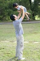 South East Asian young father mother daughter son parent boy girl child activity photo