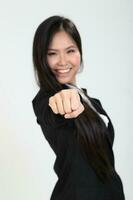 One young Asian Malaysian business office woman holding blank copy text space sign board on white background photo