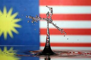 Water droplet drop splash collision dripping pillar Malaysia Flag reflection refraction independence country patriot photo