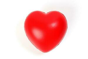 Hart Love shape plastic rubber object on white background photo