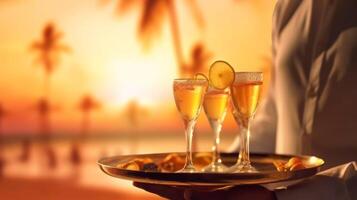 Waiter serving champagne on a tray. Summer beach sunset holiday vacation at beach with palm trees, photo