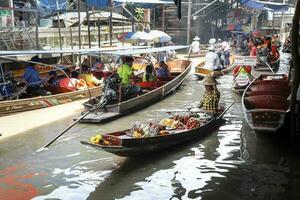 BANGKOK, THAILAND May 03, 2019 Damnoen Saduak Floating Market is a floating market in Damnoen Saduak District, Ratchaburi Province, about 100 kilometers southwest of Bangkok. photo