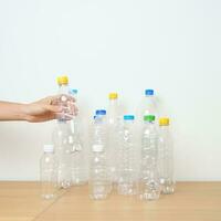 Plastic bottle on table at home or office. Recycle garbage Sorting. Plastic Free, Ecology, Environmental, pollution, Dispose recycling, waste management and trash Separation concept photo