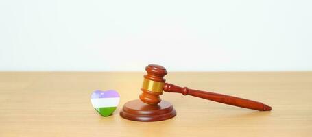 Queer Pride Day, LGBTQ Law and Pride month concepts. gavel justice hammer with purple, white and green heart shape for Lesbian, Gay, Bisexual, Transgender, Intersex photo