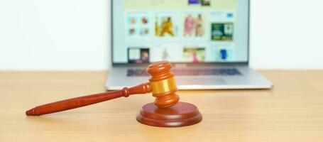 Judge gavel and laptop. online auction and bidding, Trade Regulations, Consumer protection Law, online shopping, E commerce, Tax, Digital, justice and judgment concept photo