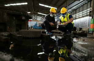 Scientists and government officials Inspect and collect chemical leak samples in industrial sites. to be thoroughly investigated in the laboratory photo