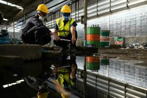 Scientists and government officials Inspect and collect chemical leak samples in industrial sites. to be thoroughly investigated in the laboratory photo