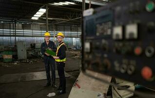 Engineers and technicians Inspect and repair mechanical systems in machine control cabinets. in order for the machine to return to normal operation photo