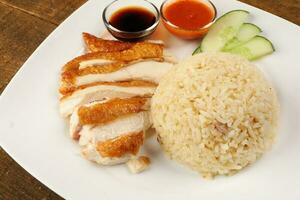 South east asian style chicken rice set steamed roasted sliced chicken with soup dark chilli sauce malaysia china photo