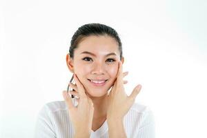 beautiful young south east Asian Chinese woman hand on cheek chin on white background photo