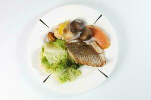 Grilled Seabass vegetable and salad photo