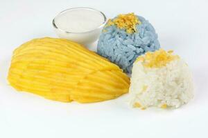 Mango butterfly pea blue white sticky rice coconut milk cream photo