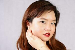 Young attractive southeast Asian woman posing facial expression photo