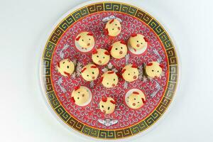 Chinese New Year rat mouse shaped cookie on decorated plate photo