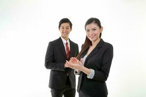 South East Asian young Chinese man woman wearing formal business office ware on white background stand clap hands cheer photo