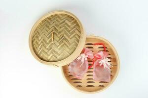 Egg flower or bunga telur a traditional malay wedding gift important part of reception door gift in bamboo steamer photo