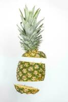 Pineapple whole rough skin slice chopped flying elevated photo