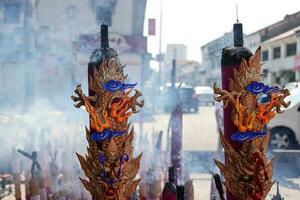 Georgetown, Penang, Malaysia-February 03, 2022- Colourful decorated prayer large joss sticks at Goddess of Mercy Temple. photo