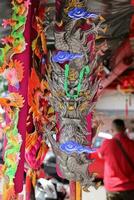 Georgetown, Penang, Malaysia-February 03, 2022- Colourful decorated prayer large joss sticks at Goddess of Mercy Temple. photo