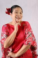 Elderly senior Asian woman posing facial expression photo