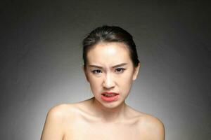 Young beautiful Asian woman facial expression photo