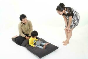 South East Asian young father mother daughter son parent boy girl child activity indoor photo