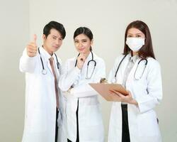 Young Asian male female doctor wearing apron uniform tunic apron hold photo