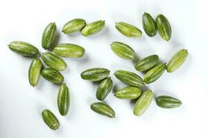 pointed gourd potol green vegetable on white background photo