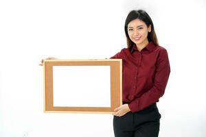 Young attractive Asian woman holding blank writing board text copy space on white background photo