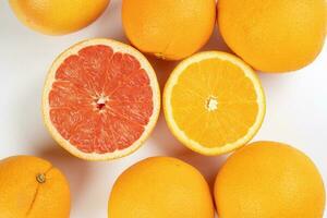 Orange grapefruit slice closeup on white background photo