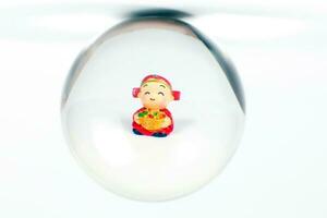 Chinese doll through glass spear photo