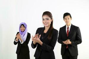 South East Asian young Malay Chinese Indian man woman wearing headscarf formal business office ware on white background stand clap hands cheer congratulate photo