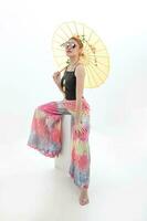 Young woman retro modern mixed culture Asian high fashion tractional chinse umbrella white background photo