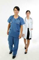 Young Asian male female doctor wearing apron uniform stethoscope walk forward towards camera photo