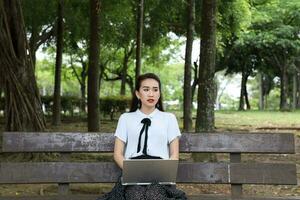 Young asian chinese woman outdoor park campus book photo