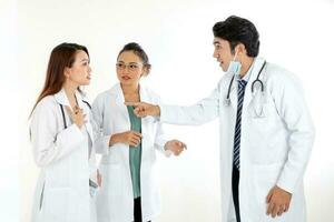 Asian Malay Chinese male female three doctors pointing towards each other on white background photo