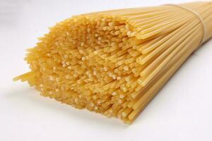 dry raw spaghetti laid on white background macro closeup photo