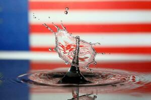 Water droplet drop splash collision dripping pillar Malaysia Flag reflection refraction independence country patriot photo