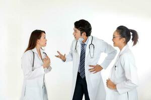 Asian Malay Chinese male female three doctors talking discussing serious on white background photo