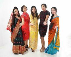 South east Asian Malay Chinese Indian race ethnic origin woman wearing dress costume baju kurung cheongsam samfu kebaya Sharee multiracial community on white background photo