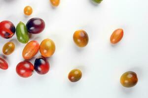 Fresh ripe mixed tomato verity assorted color on white background photo