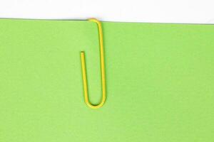 Paper clip holding on blank colour paper text copy space note photo